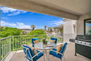 View of patio featuring a balcony and grilling area