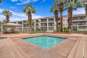 Community pool with a patio area