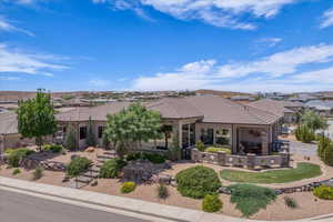 Ranch-style home with a tile roof, a residential view, and a patio