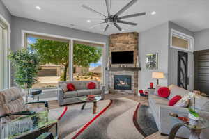 Living room featuring ceiling fan, healthy amount of natural light, wood finished floors, and recessed lighting