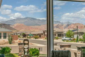 View of mountain backdrop featuring nearby suburban area