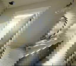 Bathroom with vanity and tile patterned floors