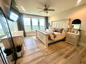 Bedroom featuring baseboards, light wood finished floors, recessed lighting, and ceiling fan