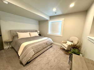 Bedroom with carpet, baseboards, and recessed lighting