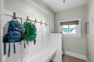 Mudroom with baseboards and wood finished floors