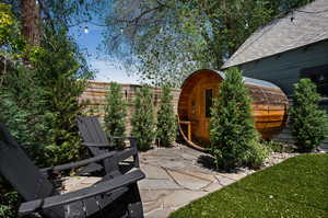 View of patio featuring fence