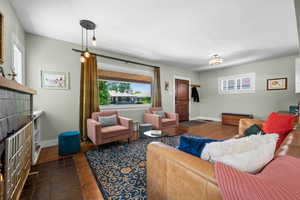 Living area with baseboards and wood finished floors