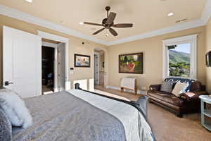 Carpeted bedroom featuring arched walkways, ornamental molding, baseboards, recessed lighting, and ceiling fan
