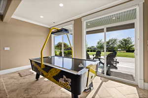 Game room with crown molding, baseboards, and recessed lighting