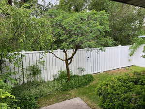 View of yard featuring fence