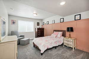 Bedroom featuring carpet flooring and baseboards