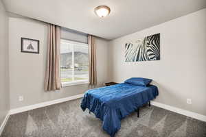 Carpeted bedroom with baseboards