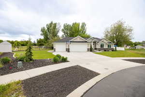 Craftsman-style house with a garage and driveway
