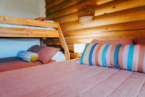 Bedroom with log walls