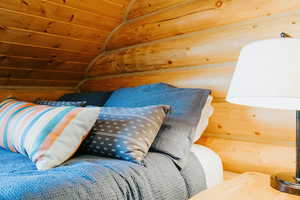 Bedroom featuring vaulted ceiling