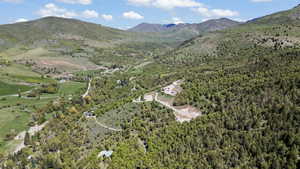 View of property location with a forest and mountains
