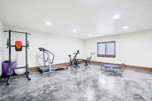 Exercise room featuring baseboards and recessed lighting
