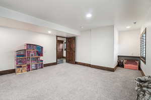 Rec room with carpet flooring, baseboards, and recessed lighting