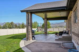 View of patio featuring a playground and a mountain view
