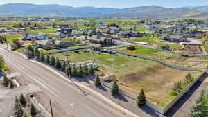 Aerial view of residential area featuring a mountainous background