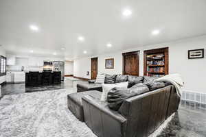 Living area featuring recessed lighting and baseboards