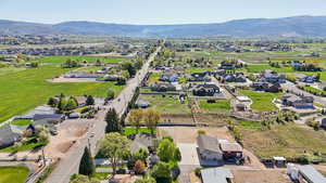 View of property location with nearby suburban area and a mountainous background