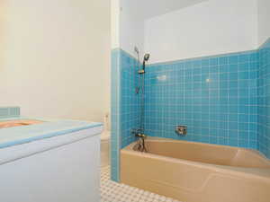 Bathroom with bathtub / shower combination and toilet