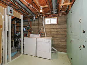 Laundry room featuring washing machine and clothes dryer and cabinet space