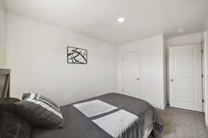 Carpeted bedroom with baseboards