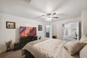 Bedroom with carpet, connected bathroom, a ceiling fan, and baseboards