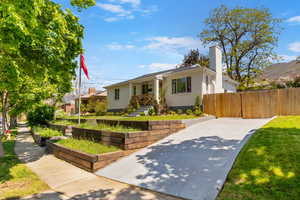 Bungalow with a chimney and fence