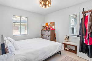 Bedroom with light colored carpet