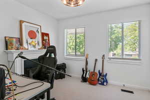 Miscellaneous room with carpet flooring and baseboards