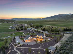 Aerial view at dusk of a mountain view and a rural view