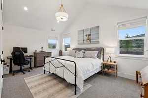 Bedroom featuring carpet floors, an office area, high vaulted ceiling, and baseboards
