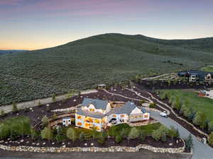 Aerial overview of property's location featuring a mountainous background