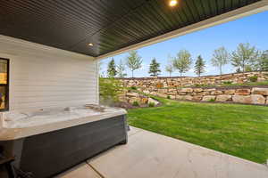 View of patio / terrace featuring a hot tub