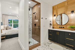 Full bath with ensuite bath, baseboards, a stall shower, recessed lighting, and vanity