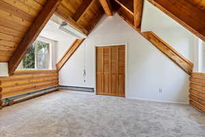 Bonus room featuring carpet, log walls, wood ceiling, and baseboards