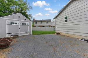 View of yard with a storage unit