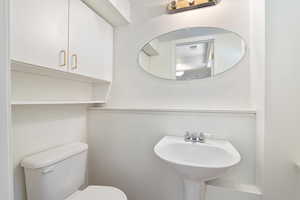 half bath that services the ballroom-style living room