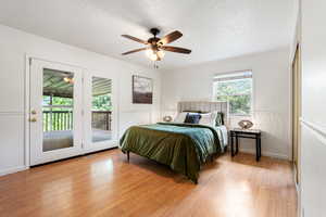 primary bedroom with french doors leading to private deck