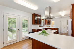 High-end Anvil designer kitchen. French doors seamless flow to the fully fenced backyard