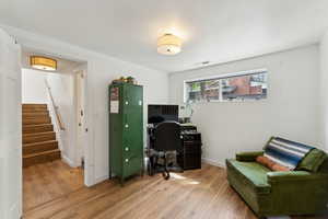 Office space with light wood finished floors and baseboards