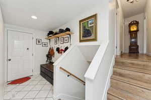 Foyer featuring light tile patterned floors
