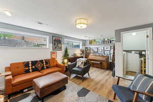 Living area with light wood-type flooring