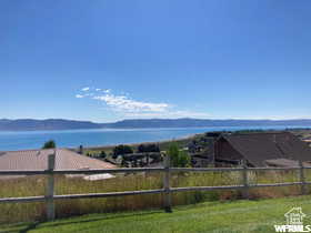 View of yard featuring a water and mountain view
