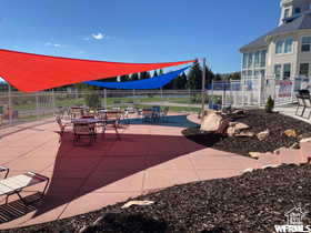 View of home's community featuring fence and a patio