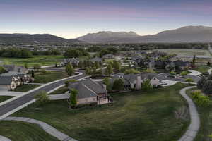 View of mountain backdrop featuring nearby suburban area