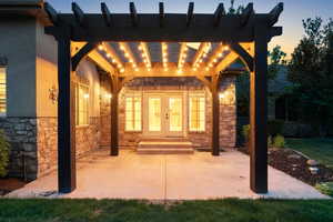 View of patio / terrace featuring french doors and a pergola
